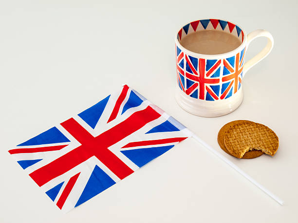 istock cup of English tea and biscuits with a flag 471628799