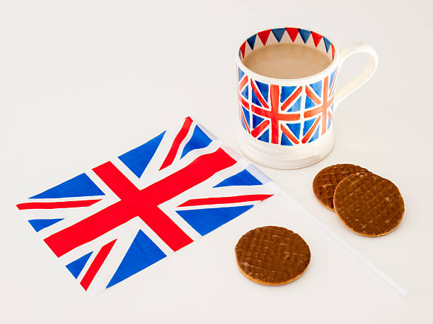 istock cup of English tea and chocolate biscuits with a flag 471628801