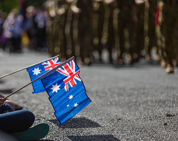 australische flags am anzac-tag - australia australia day celebration flag stock-fotos und bilder