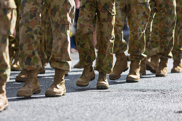 Feet of Soldiers Marching at ANZAC Day Feet of soldiers marching at an ANZAC Day parade on the streets of a regional country town marching photos stock pictures, royalty-free photos & images