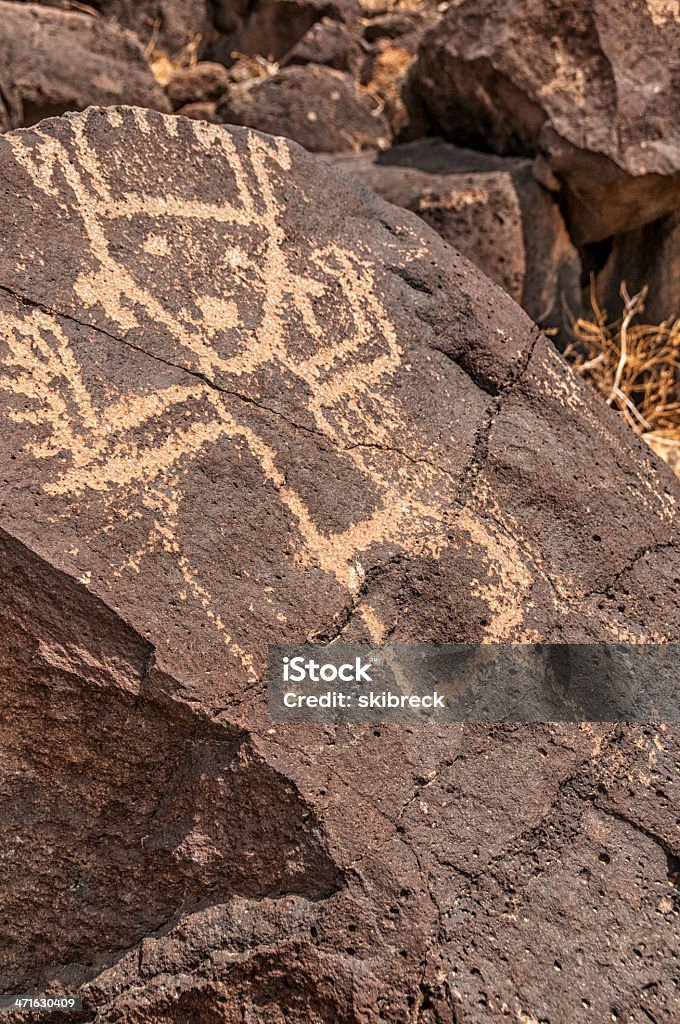 Petroglyph of Kachina Dancer A petroglyph of a Kachina Dancer found in Petroglyph National Monument in New Mexico, USA. Art Stock Photo