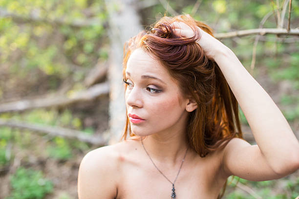 istock Lady holding her hair 471630600