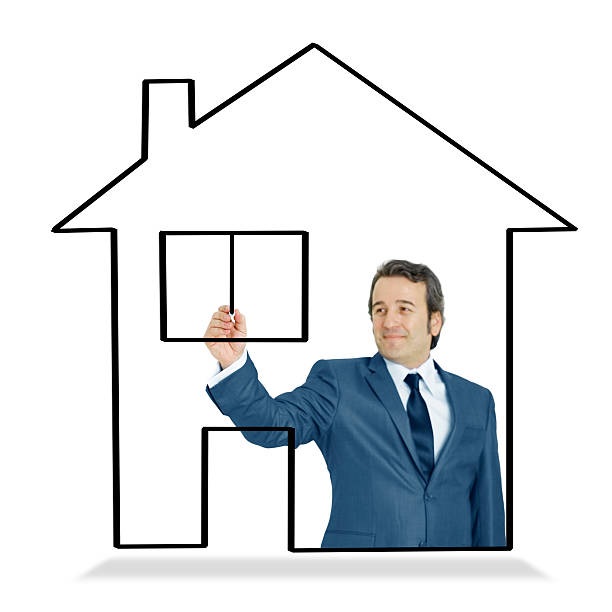 istock Businessman drawing home plan 471632347