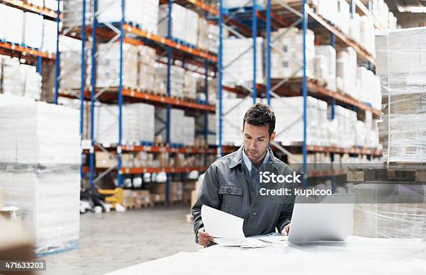 Prioritising The Deliveries Stock Photo - Download Image Now - Warehouse, Freight Transportation, Manager