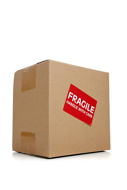 istock Cardboard moving box with a fragile sticker 471634079