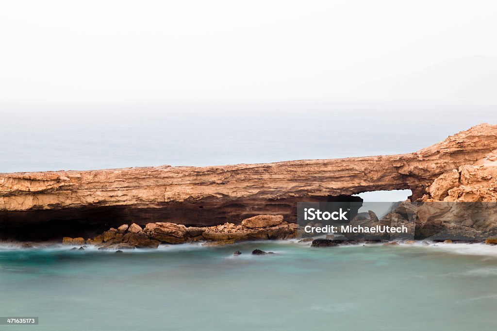 Rocce di lunga esposizione arco - Foto stock royalty-free di Acqua