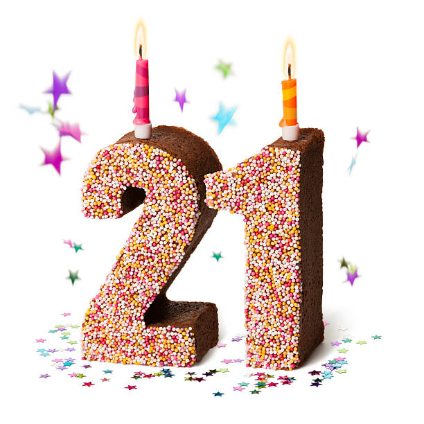 istock Number twenty one chocolate birthday cake with candles 471635991