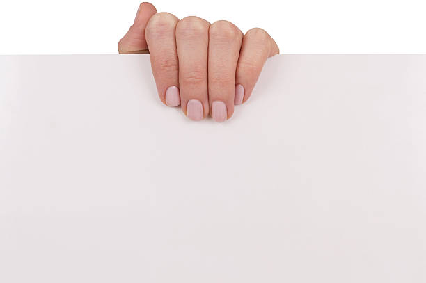 istock woman hand holding white empty board isolated over white 471637036