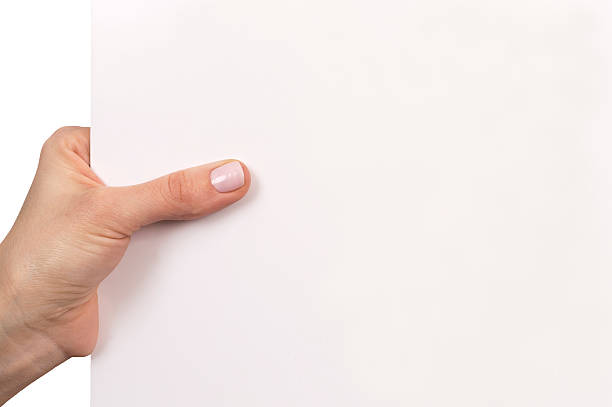 istock woman hand holding white empty board isolated over white 471637062