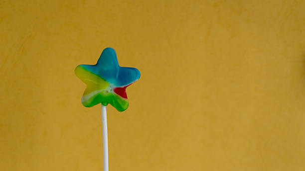istock Colorful and various shape of lollipop on colour background 471637602