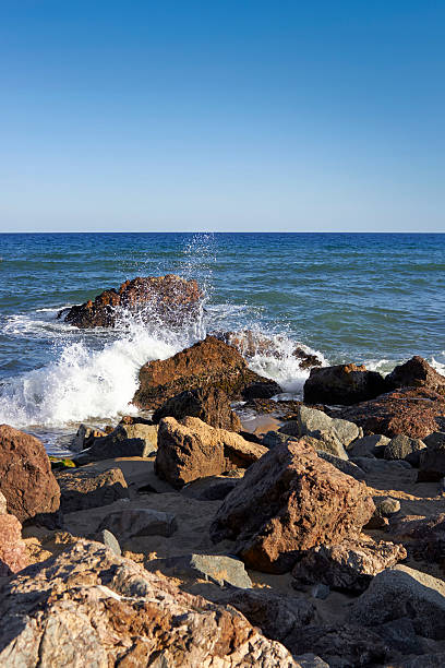 istock Sea waves crashing against the rocks 471637782