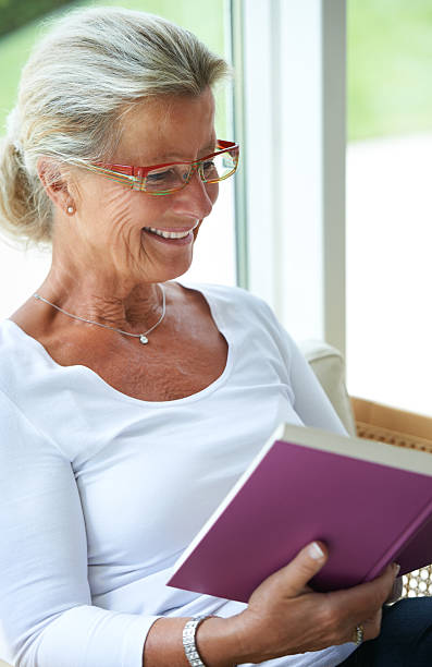 istock She's absorbed in the story! 471638469