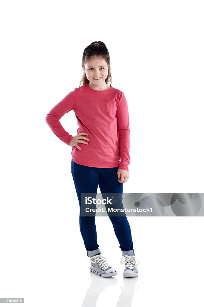 Beautiful little girl standing on white Studio shot of beautiful little girl standing on white background Girls Stock Photo