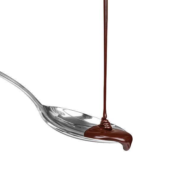 istock hot chocolate pouring stream with a spoon on a spoon on a white background 471641416