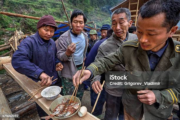 Sharing Food On A Rural Celebration Local People Farmers China Stock Photo - Download Image Now