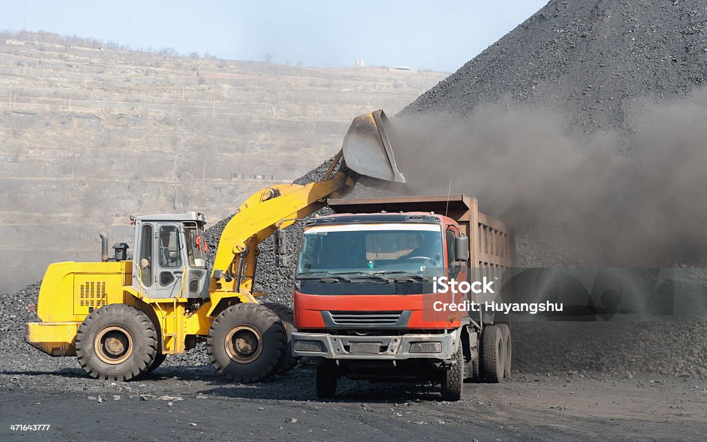 Open-pit Mine with Earth Move Open-pit Mine with Earth Mover with stones Backhoe Stock Photo