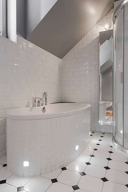 istock Porcelain bathtub in white washroom 471643872