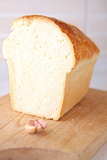 istock bread slice and garlic at wooden table 471644441