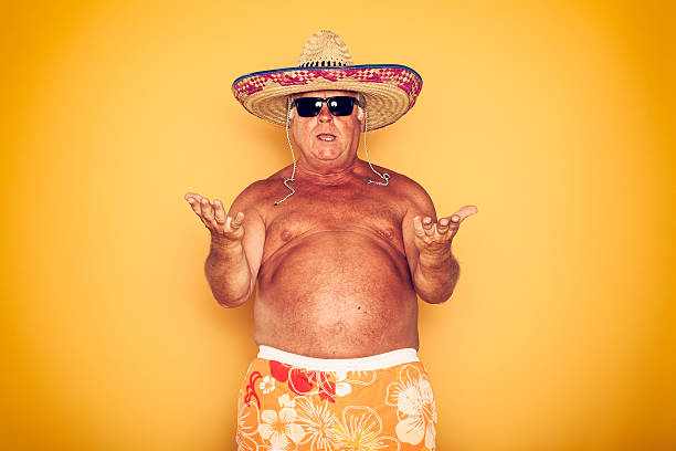 the tourist-cool sombrero humor hawaiian - swim truncks stock-fotos und bilder