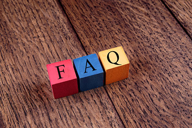 istock Colorful cubes with an inscription FAQ on old oak boards. 471646588