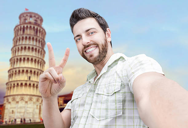 istock Happy young man taking a selfie photo in Pisa 471647442