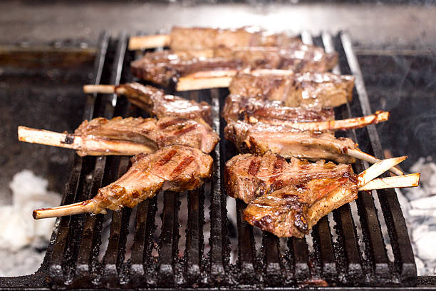 istock lamb ribs cooking on a grill 471648343