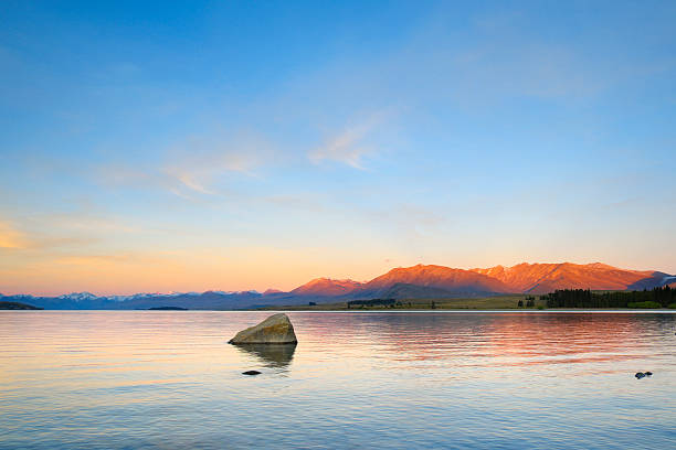 Evening descends upon the waters of Lake Tekapo on New Zealand's South Island. 