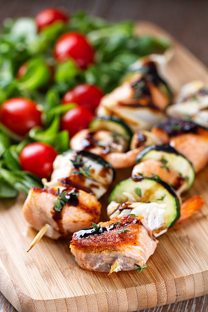 istock Fish skewers with salad 471649249