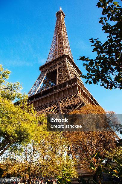 Golden Autumn Eiffel Tower Low Angle Stock Photo - Download Image Now - Arch - Architectural Feature, Architecture, Arts Culture and Entertainment