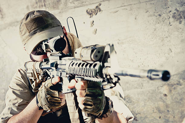 istock Young Caucasian Modern Army Soldier Aiming with Assault Rifle 471651409
