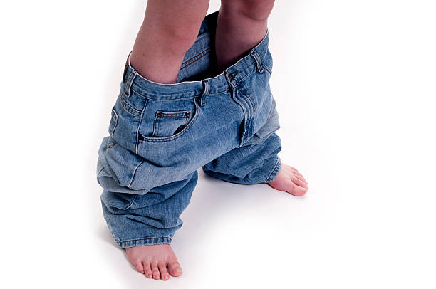 istock Young girl with pants down 471651988