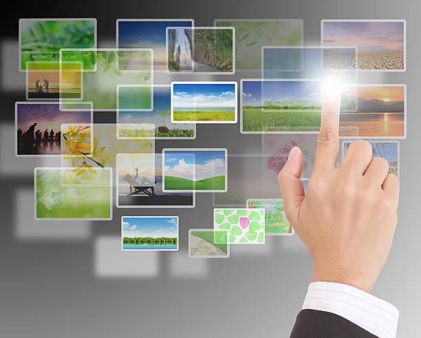 istock Male hand selecting images multimedia information flow 471651999
