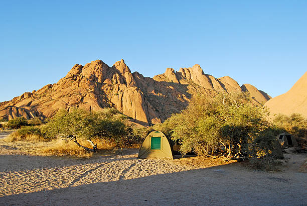 Camping at Spitzkoppe in the Namib desert of Namibia Africa Camping at Spitzkoppe in the Namib desert of Namibia Africa horizon over land stock pictures, royalty-free photos & images