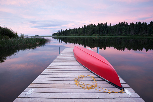 Wekusko Falls provincial park, Northern Manitoba.  Wekusko lake with canoe.