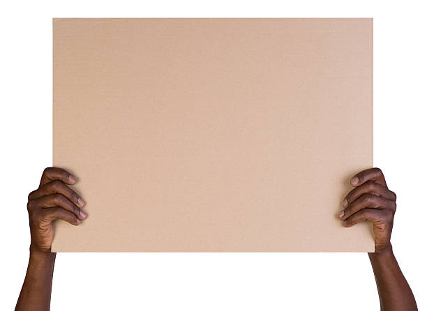 Man's hands holding a blank taupe colored board