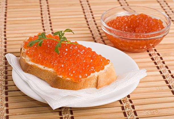 bread with red caviar stock photo