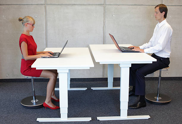 istock Business people co workers in correct sitting posture at desks 471654076