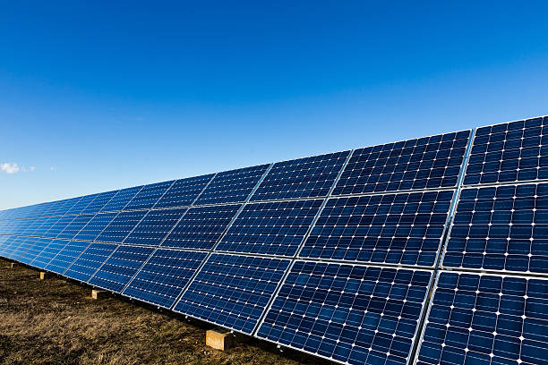 istock Blue solar panels and the sky background 471654218