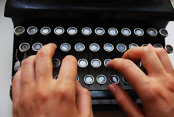 istock Detail of the keyboard, typewriter with two hands 471655143