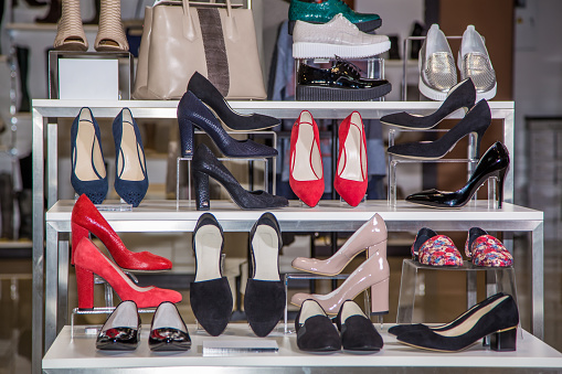 Large selection of women's shoes on the shelf in the store