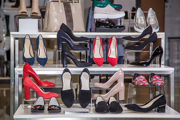 Large selection of women's shoes on the shelf Large selection of women's shoes on the shelf in the store shoe store stock pictures, royalty-free photos & images