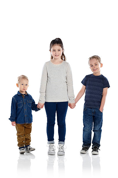 istock Happy little children standing in studio 471656226