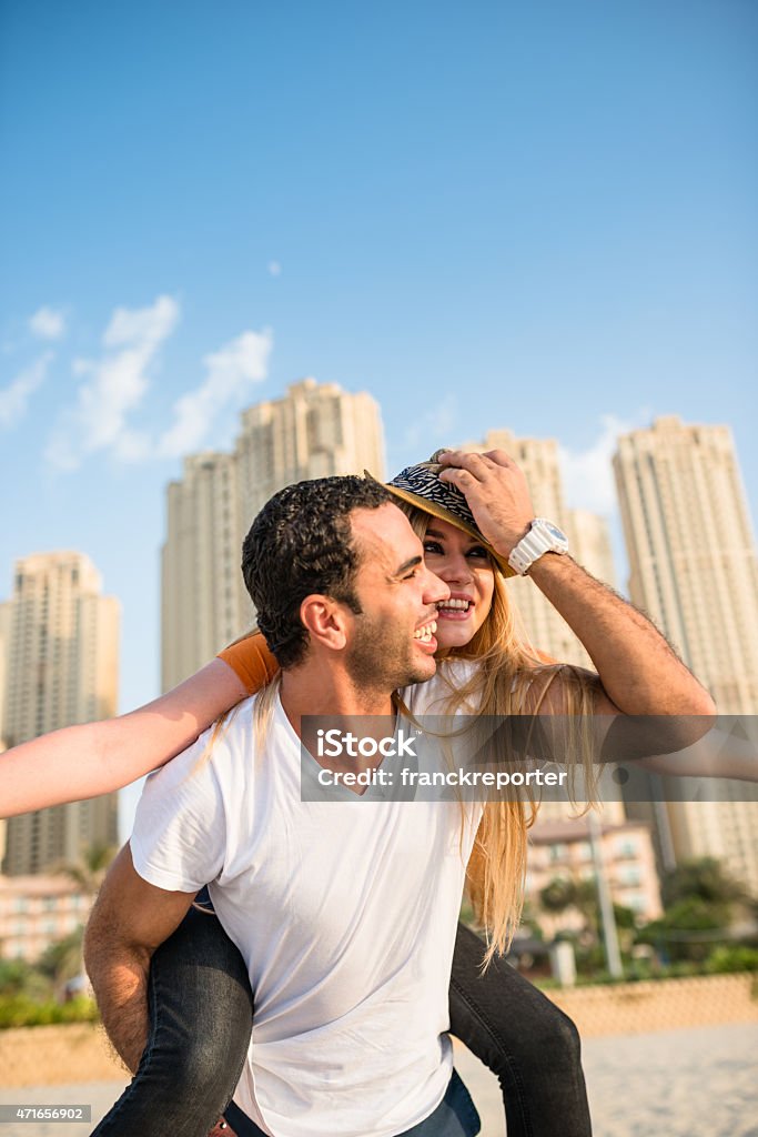 togetherness couple on the beach in Dubai marina togetherness couple on the beach Men Stock Photo