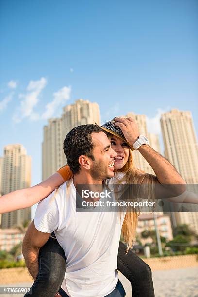 Togetherness Couple On The Beach In Dubai Marina Stock Photo - Download Image Now - Men, White People, 20-24 Years