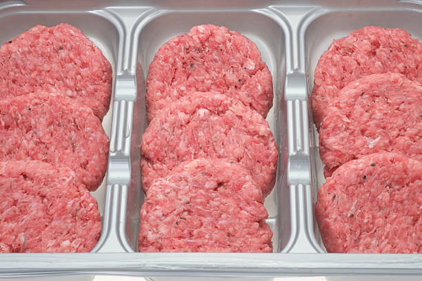 istock Raw burgers in retail packaging 471657281
