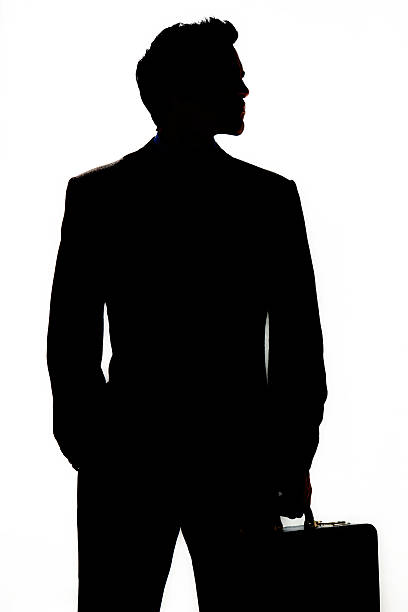 istock Businessman silhouette with suitcase 471658885