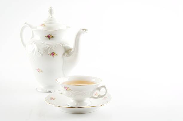 istock Old-style retro jug with tea on white background 471659782