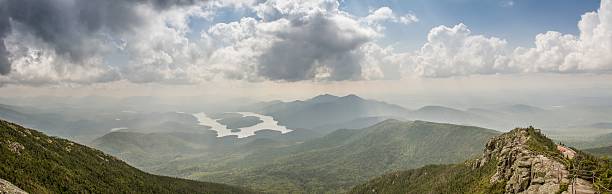 Panoramic view of Adirondacks, NY ; Mountain landscape, Lake Placid Panoramic view of Adirondacks, New-York State, USA. A beautiful Mountain landscape over Lake Placid with a cloudy sky. whiteface mountain stock pictures, royalty-free photos & images