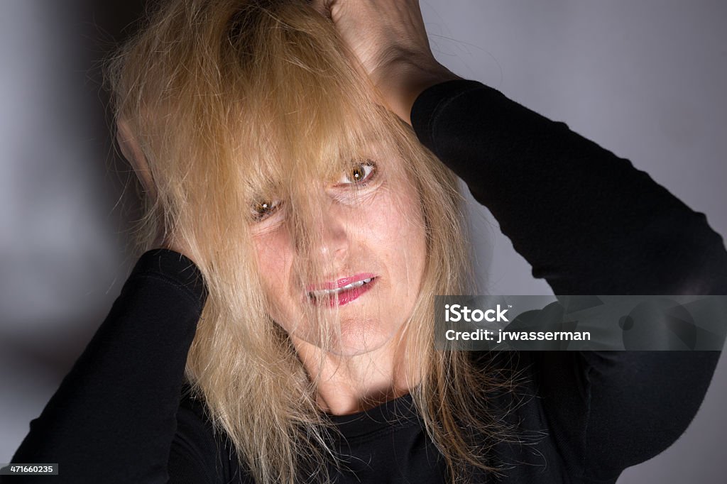 Bad Mental Health Moment Crazy, angry woman pulling hair out for mental health concept Adult Stock Photo