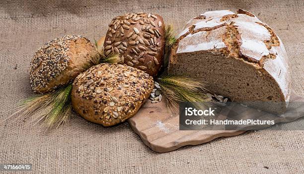 Heap Of Bread On Cutting Board Stock Photo - Download Image Now - Backgrounds, Baguette, Baked
